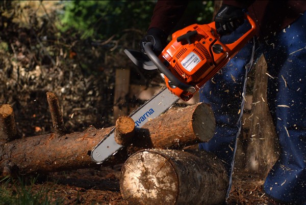 Chainsaw cutting wood in slow-motion